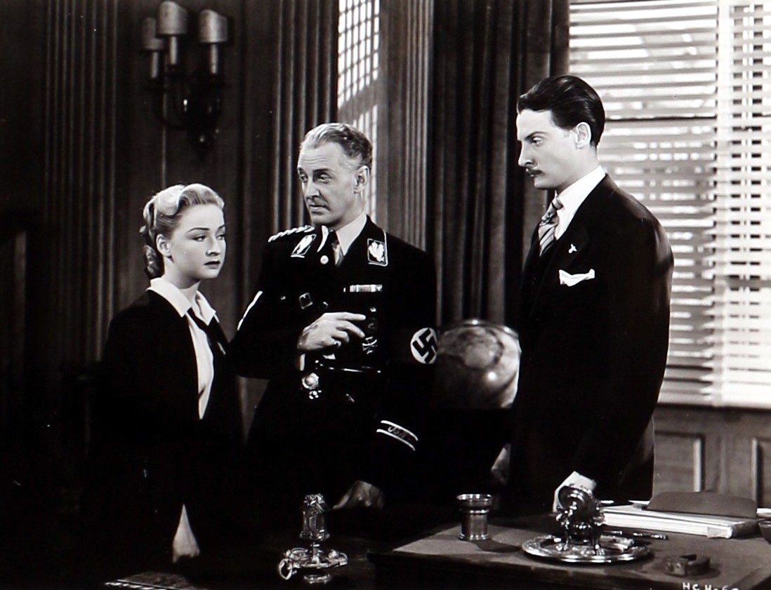 Hans Conried, Bonita Granville, and Otto Kruger in Hitler's Children (1943)