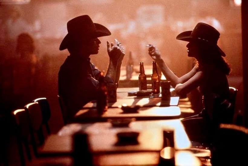 John Travolta and Debra Winger in Urban Cowboy (1980)