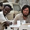 Evan Peters and Barkhad Abdi in The Pirates of Somalia (2017)