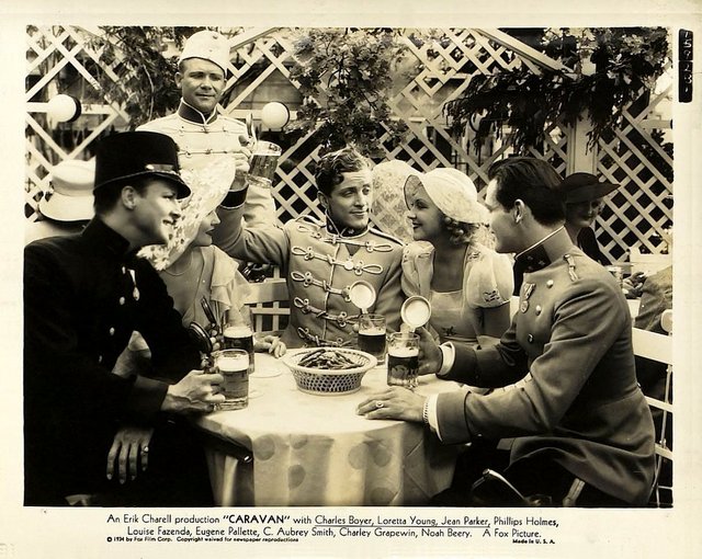 Joyce Compton, Ray Cooke, Phillips Holmes, and Barry Norton in Caravan (1934)