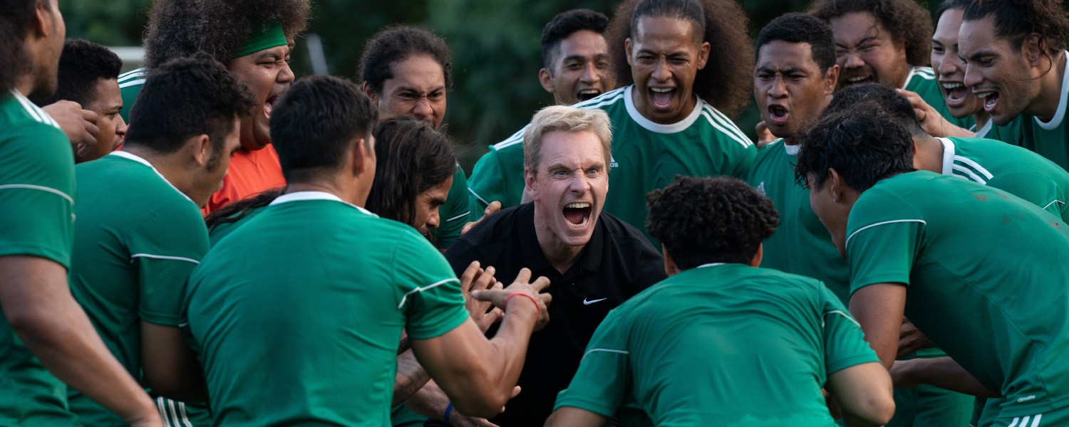 Michael Fassbender, Beulah Koale, and Lehi Makisi Falepapalangi in Next Goal Wins (2023)