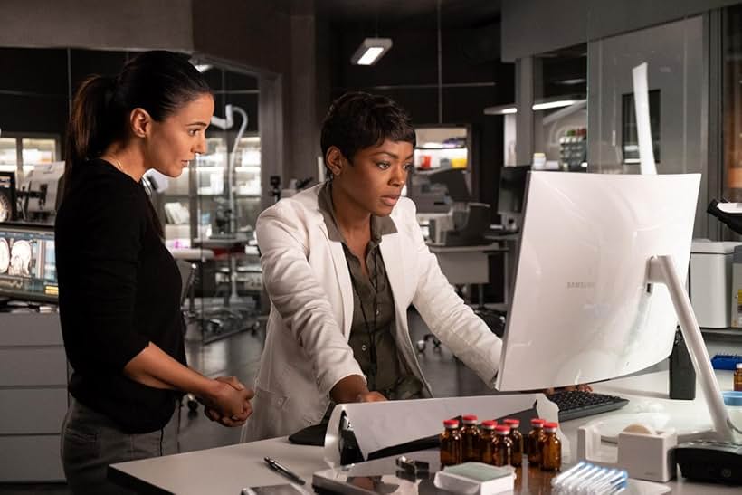 Emmanuelle Chriqui and Caroline Chikezie in The Passage (2019)