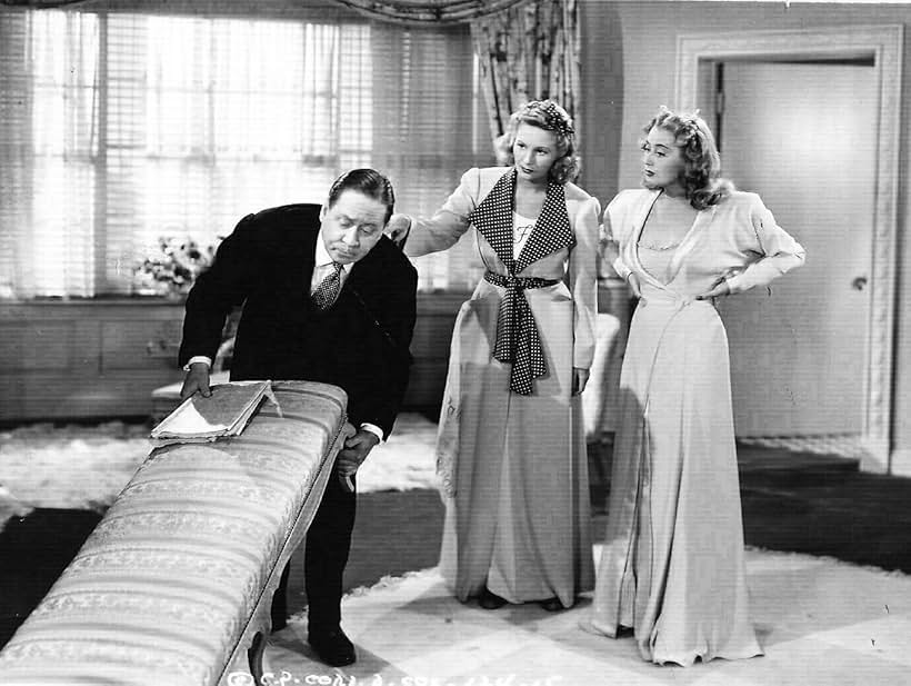 Joan Blondell, Robert Benchley, and Janet Blair in Three Girls About Town (1941)