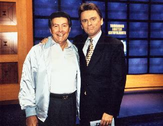 Johnny Gilbert and Pat Sajak in Jeopardy! (1984)