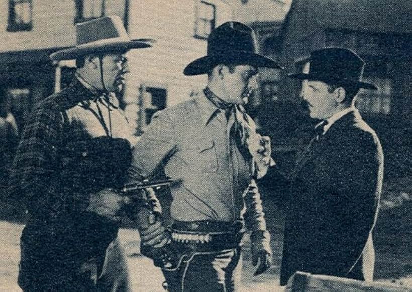 Dick Curtis, Kenneth MacDonald, and Charles Starrett in Bullets for Rustlers (1940)