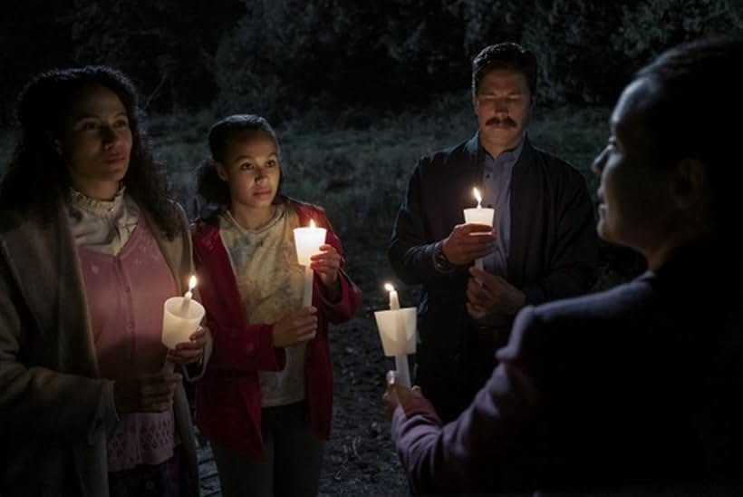 Michael Trucco, Annarah Cymone, and Crystal Balint in Midnight Mass (2021)