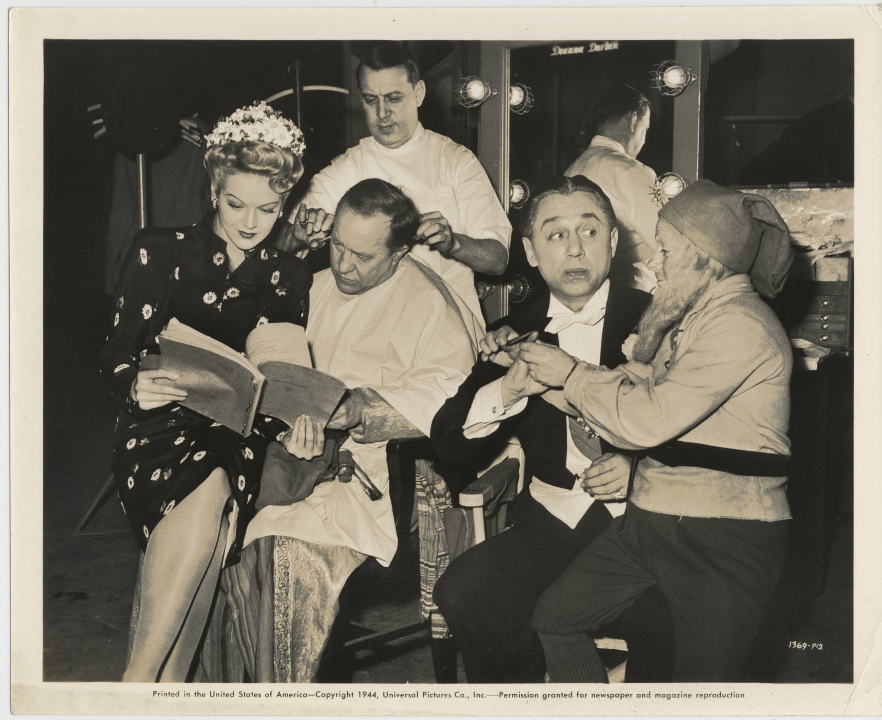 Billy Curtis, Chic Johnson, Martha O'Driscoll, and Ole Olsen in Ghost Catchers (1944)