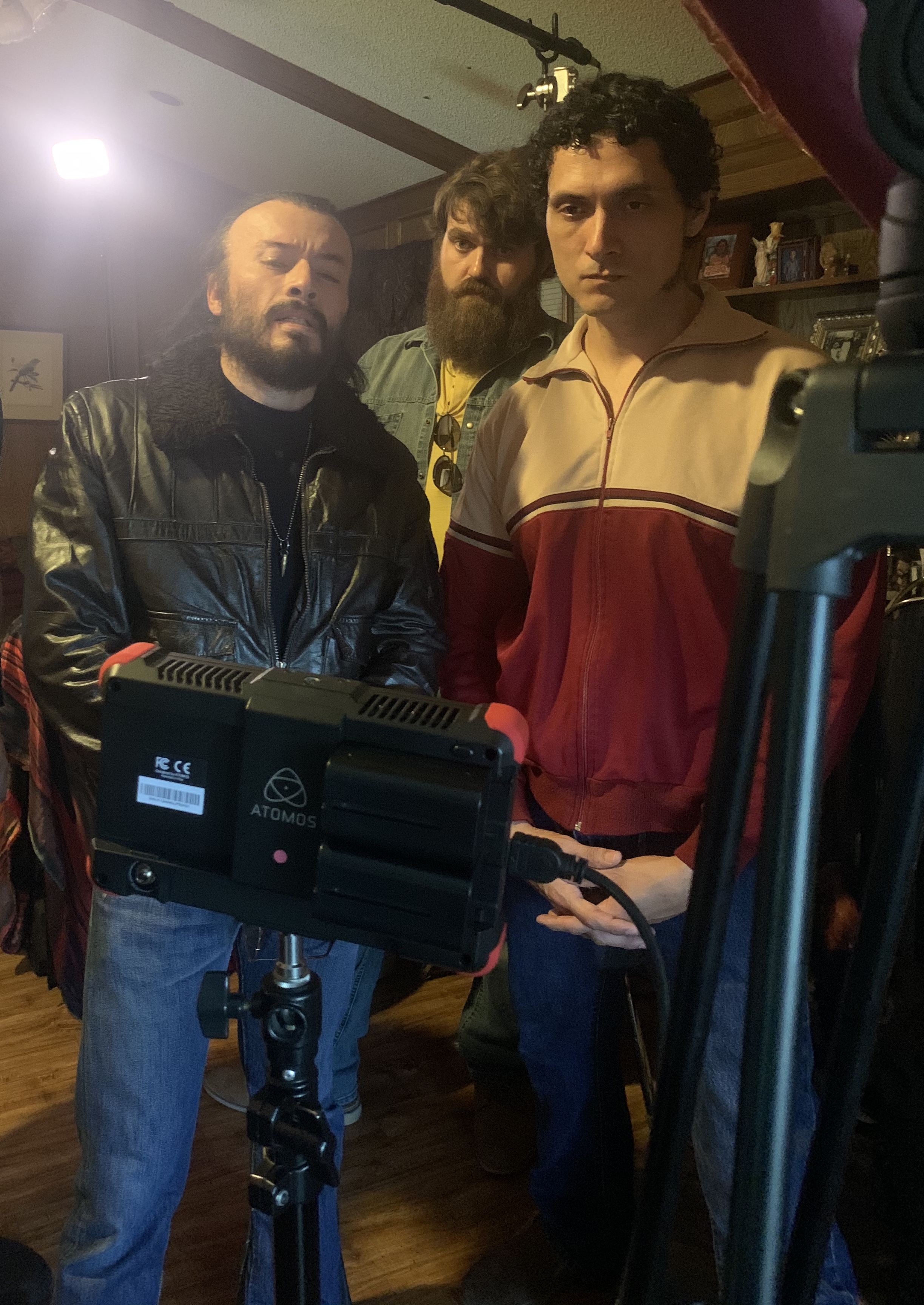 Actors Billy Blair, Brandon Krum and Director Abel Berry watching playback on set of STRIX.