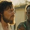 Evan Peters and Barkhad Abdi in The Pirates of Somalia (2017)