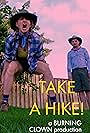 Mike Smith Rivera and Kelly Anne Burns in Take A Hike! (2021)