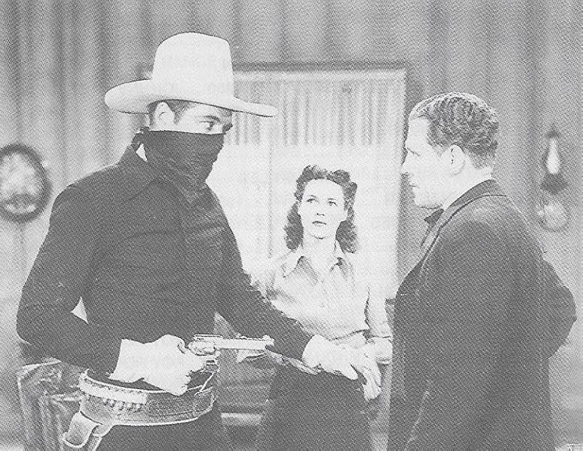 Kenneth MacDonald, Charles Starrett, and Luana Walters in The Durango Kid (1940)