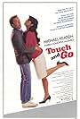 Michael Keaton and Maria Conchita Alonso in Touch and Go (1986)