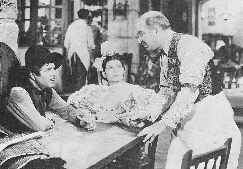 Rita Hayworth, Warner Baxter, Maurice Black, and Paul Porcasi in Under the Pampas Moon (1935)