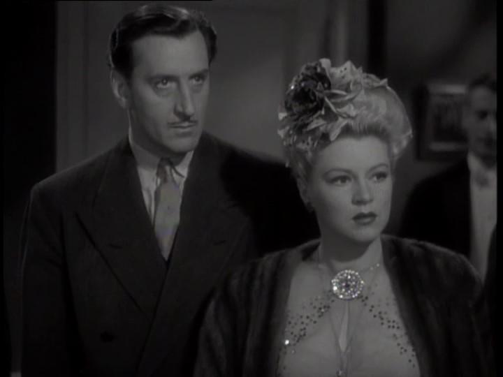 Basil Rathbone and Claire Trevor in Crossroads (1942)