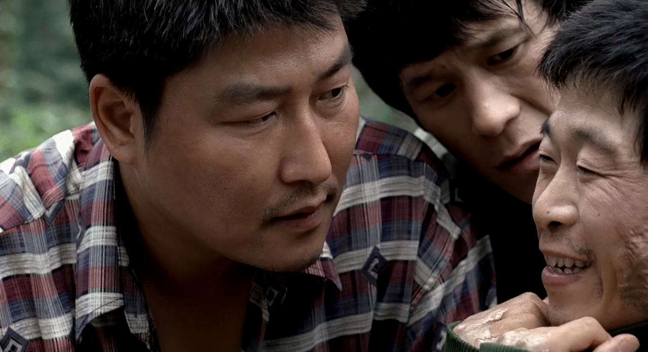 Song Kang-ho, Kim Roe-ha, and Park No-shik in Memories of Murder (2003)