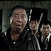 Song Kang-ho, Park Hae-il, and Byun Hee-Bong in Gwoemul (2006)