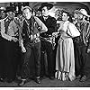 Nancy Gates, Lash LaRue, Buster Slaven, and Al St. John in Cheyenne Takes Over (1947)