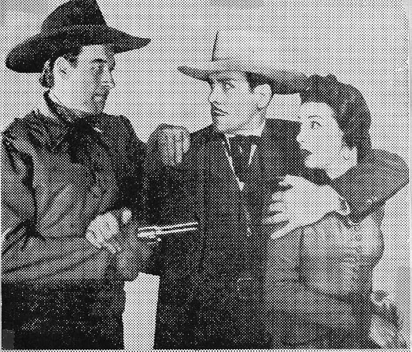 Bill Elliott, Kenneth MacDonald, and Carmen Morales in The Valley of Vanishing Men (1942)