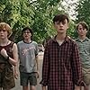 Wyatt Oleff, Jeremy Ray Taylor, Jaeden Martell, Finn Wolfhard, Sophia Lillis, and Chosen Jacobs in It (2017)