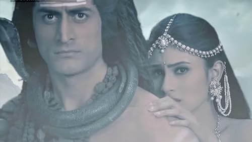 Mohit Raina and Mouni Roy in Shiva saves Sati in the storm (2012)