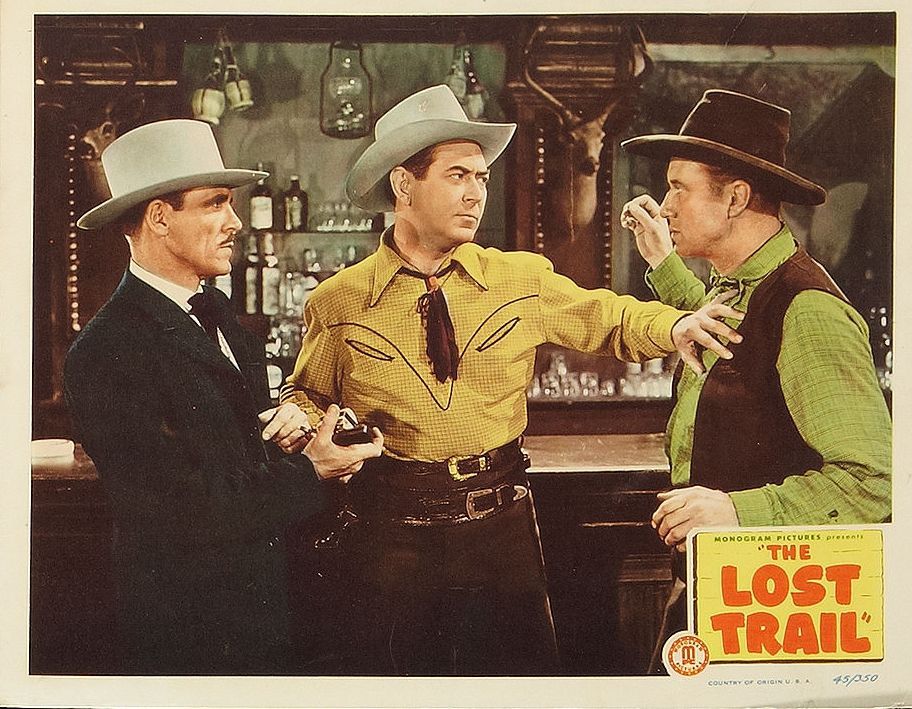 Johnny Mack Brown, Kenneth MacDonald, and Eddie Parker in The Lost Trail (1945)