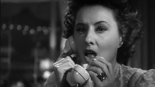 While on the telephone, a physically impaired woman overhears what she thinks is a murder plot and attempts to prevent it.