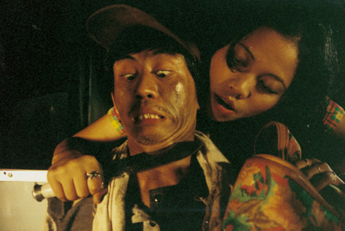 Epy Kusnandar and Maria Gorethi Megarita in Be Careful at Night (2001)