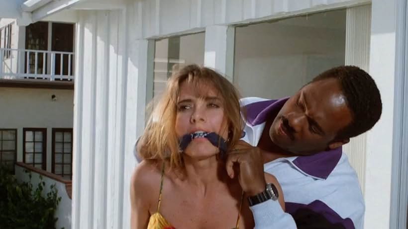 Fabiana Udenio and Gregory Alan Williams in Stakeout at Surfrider Beach (1993)