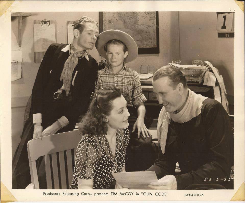 Tim McCoy, Lou Fulton, Inna Gest, and Robert Winkler in Gun Code (1940)