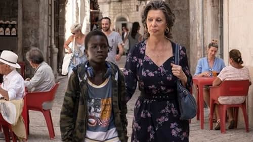 In seaside Italy, a Holocaust survivor with a daycare business takes in a 12-year-old street kid who recently robbed her.