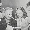 Olivia de Havilland, George Brent, Tim Holt, and Clements Ripley in Gold Is Where You Find It (1938)