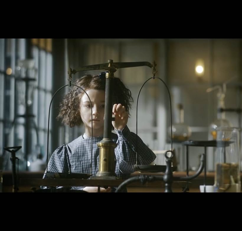 Indica Watson as Irène Curie in RADIOACTIVE, 2020