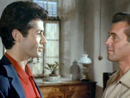 Dirk Bogarde and George Chakiris in McGuire, Go Home! (1965)