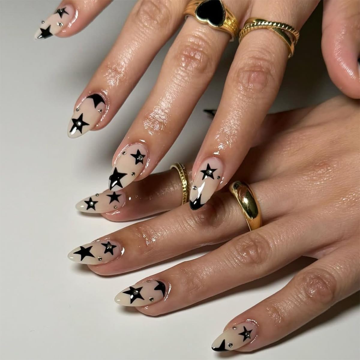 Star Press on Nails Medium Almond Fake Nails Black Star Glue on Nails Rhinestone Stick on Nails Full Cover Nude Acrylic Nails Stiletto Shiny Artificial Nails for Women Girls Manicure 24Pcs