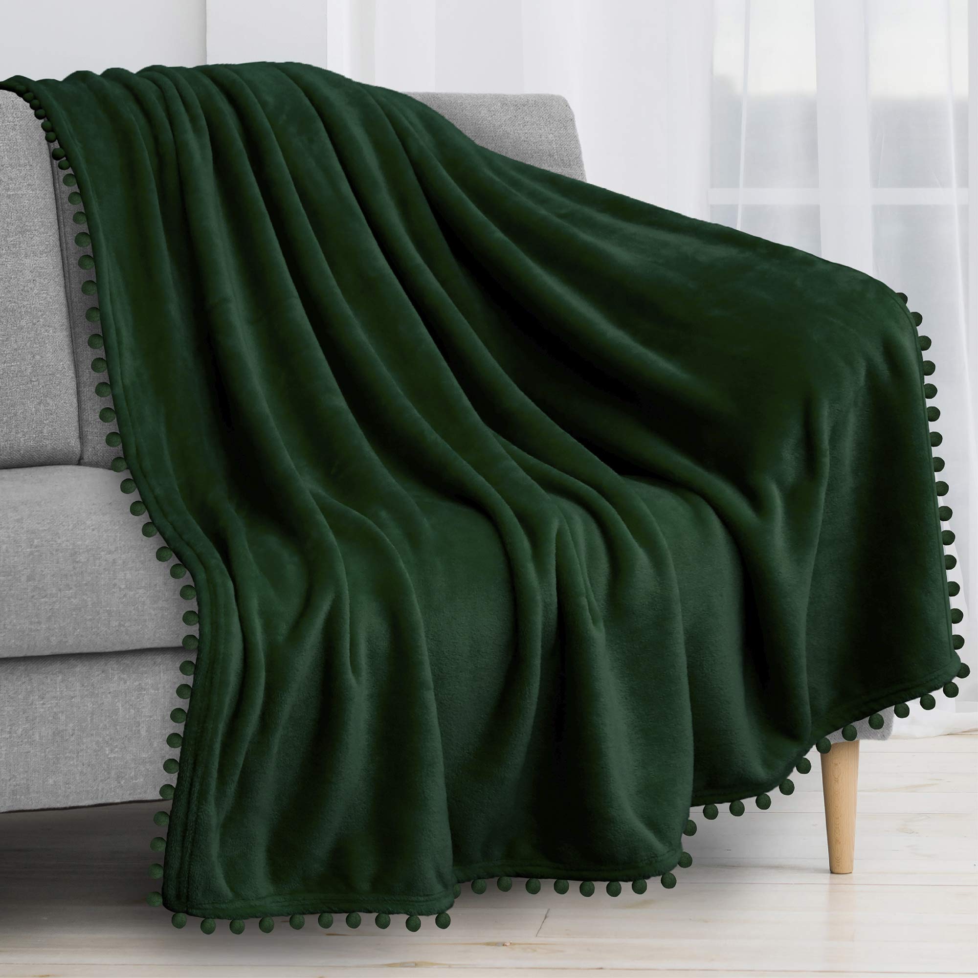 PAVILIAFleece Throw Blanket for Couch with Pom Pom Fringe, Emerald Green, Soft Cozy Fuzzy Flannel Blanket for Sofa Bed, Lightweight Plush All Season Throw, 50x60 Inches