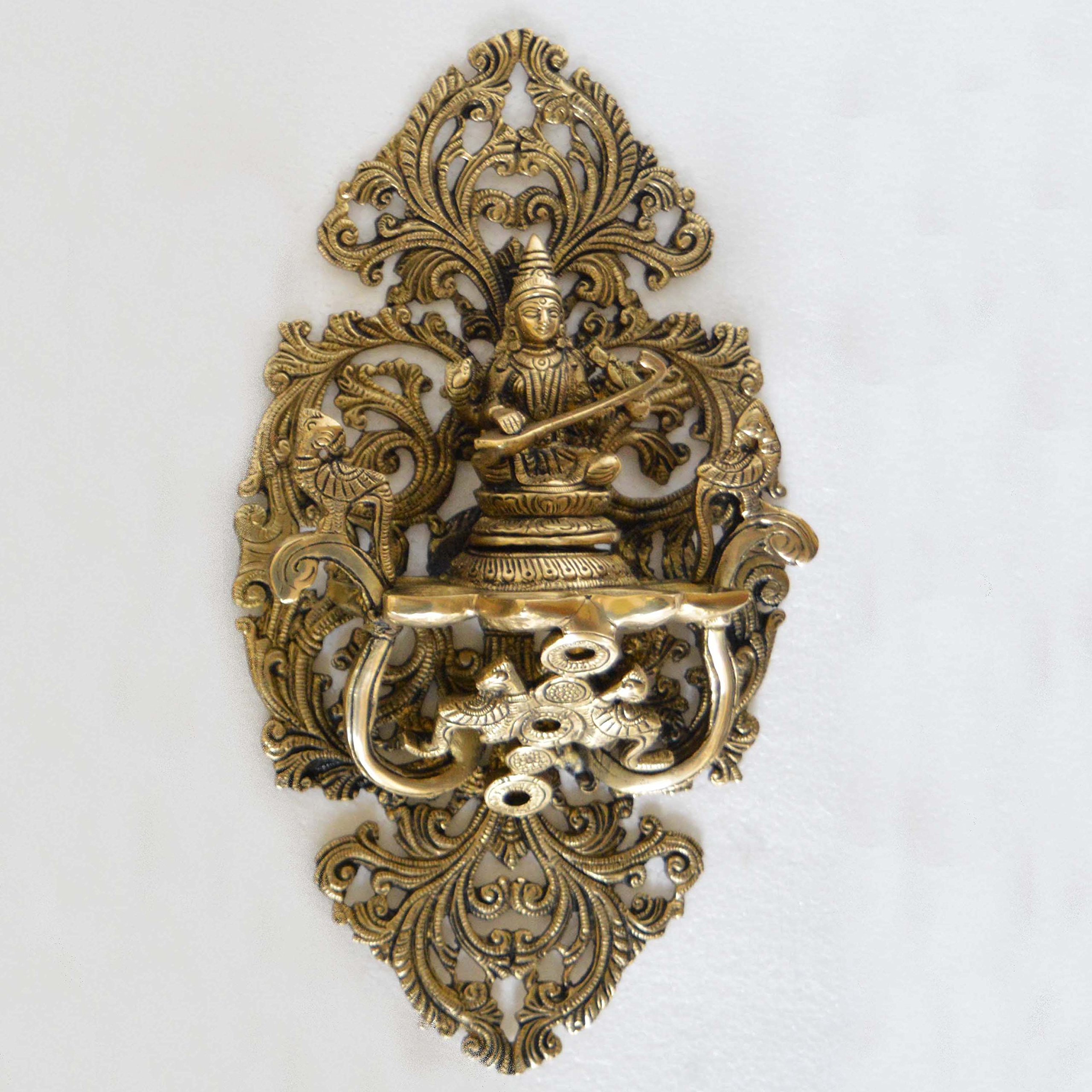 Goddess Saraswati Wall Plate Oil Deepak Or Diya with Unique Carving for Decor and Gifting Home decoration And wall décor - Hindu Goddess Saraswati statues. Saraswati, goddess of knowledge and the arts, embodies the wisdom of Devi