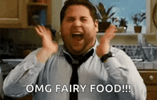 a man in a tie is screaming in a kitchen and saying `` omg fairy food !! ''