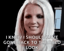 britney spears is smiling and saying `` i knew i should have gone back to the bald look ''