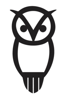 a black and white owl with a circle around it 's head