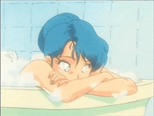 a girl with blue hair is taking a bath in a tub