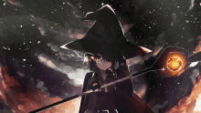 a girl in a witch hat is holding a wand in her hand