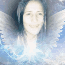 a woman 's face is surrounded by angel wings on a blue background