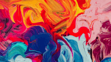 a close up of a colorful painting with red yellow and blue