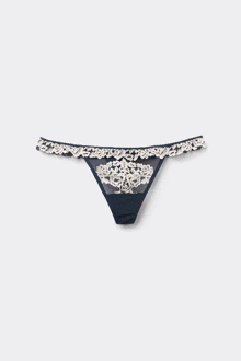 a blue thong with white lace on the side