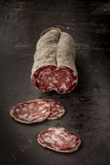 a sliced sausage is sitting on a table