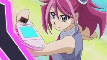 a girl with pink hair and blue eyes is holding a pink phone in her hand .