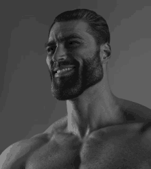 a shirtless man with a beard is smiling