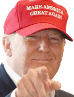 a man wearing a make america great again hat points at the camera