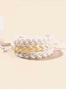 a close up of a bracelet on a table .