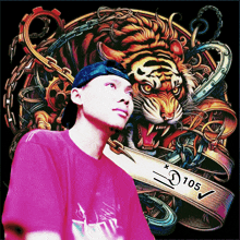 a man in a pink shirt stands in front of a colorful tiger with the number 105 on the bottom